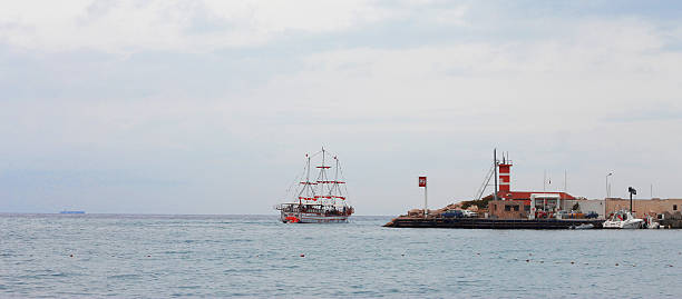 istock Sail ship moving away from the shore 508820317