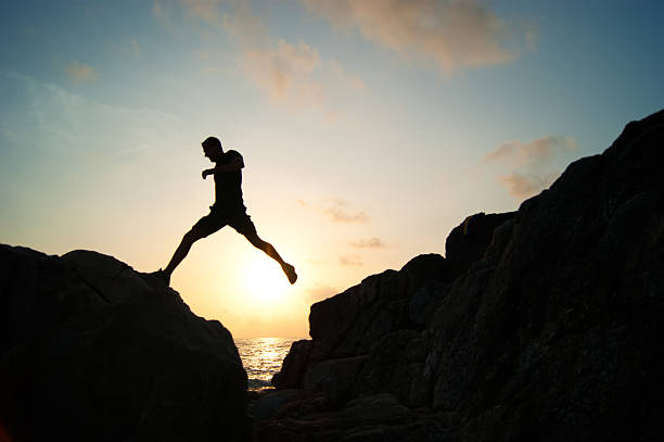 istock The jumping man on rocks 508831084