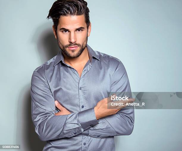 Handsome Young Man In Suit On Grey Background Stock Photo - Download Image Now - Men, Fashion Model, Only Men