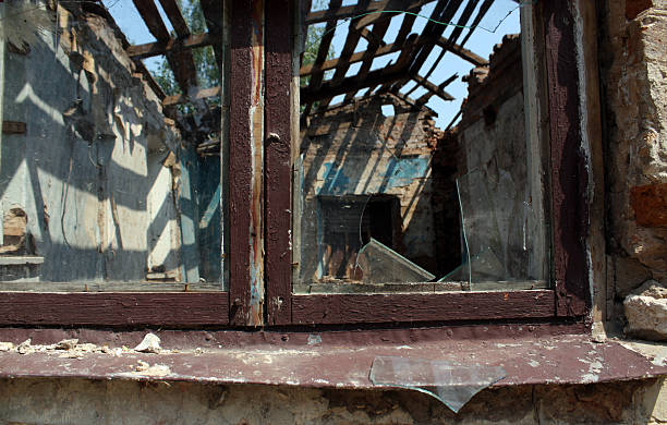 istock Broken window and ruined old house. 508833664