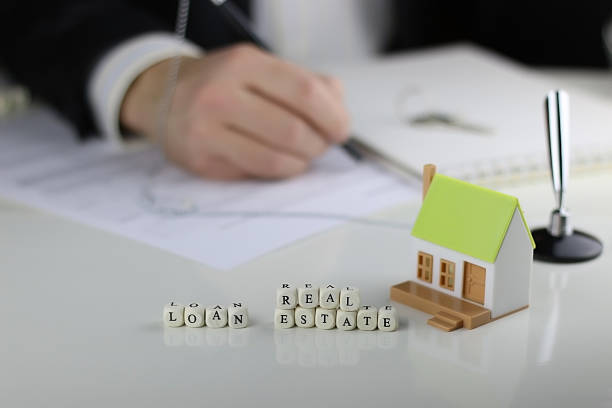 istock House Agents hands a contract loan mortgage 508834956
