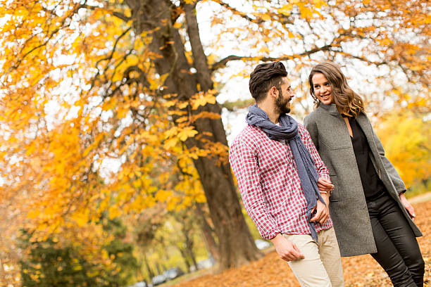istock Young couple in the autumn park 508836832