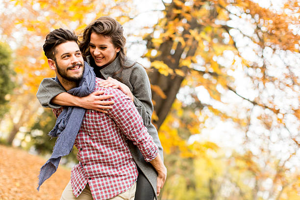 Young couple in the autumn forest