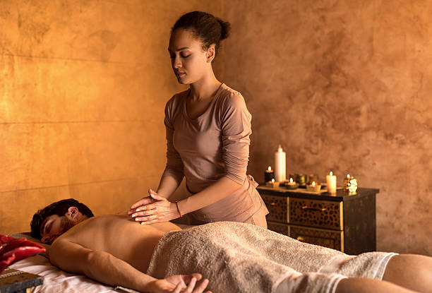 istock African American therapist massaging man's back at spa. 508837782