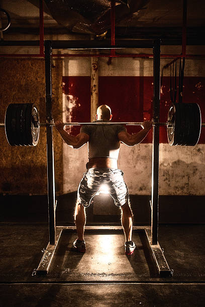 istock Barbell weight lifting man rear view workout gym 508838978