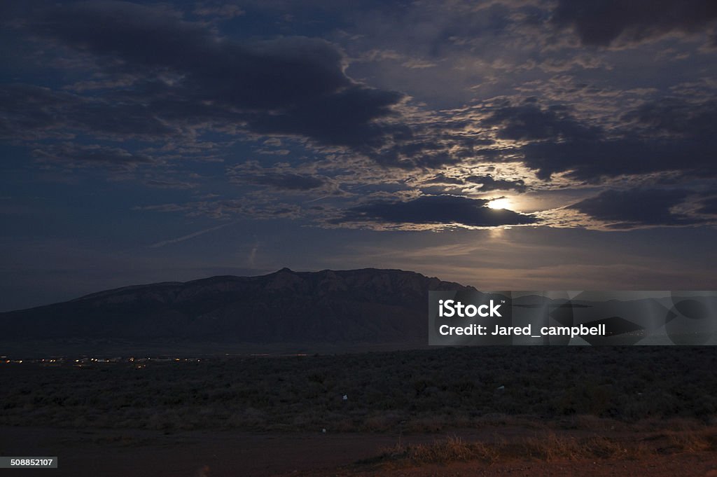 moon rise over mountains moon rise over sandia mountains new mexico, USA Sandia Mountains Stock Photo