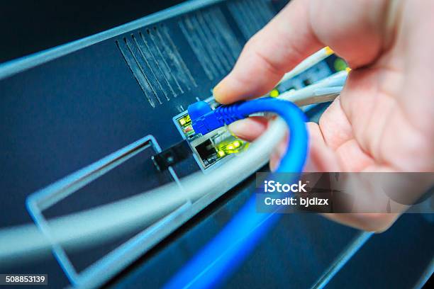 Network Tech Stock Photo - Download Image Now - Fiber Optic, Installing, Network Connection Plug