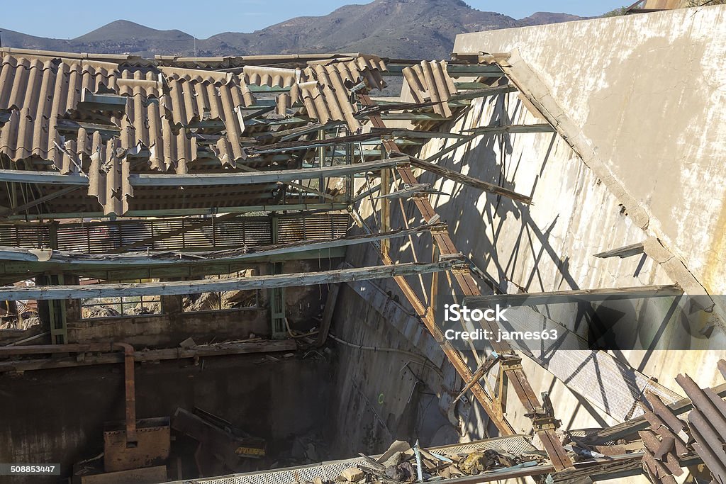 broken and destroyed roof of an old abandoned industry Abandoned Stock Photo