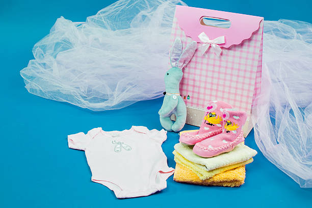 istock The baby clothes with a  gift box 508855124