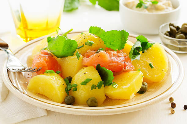 istock Boiled potatoes with green onions and salt salmon. 508855966