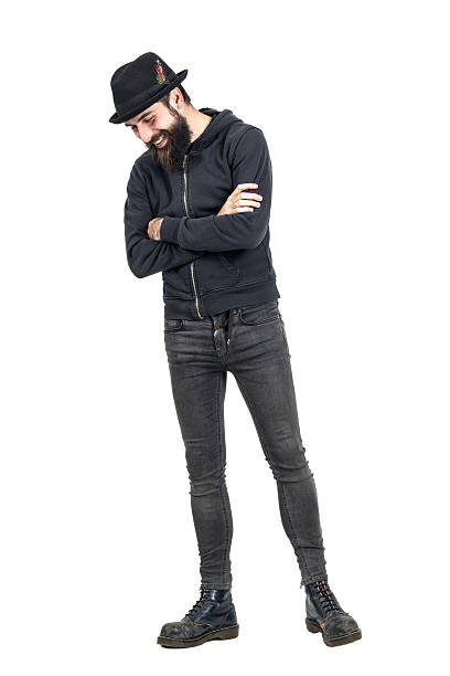 istock Happy spontaneous laughing hipster with fedora hat looking down 508856256