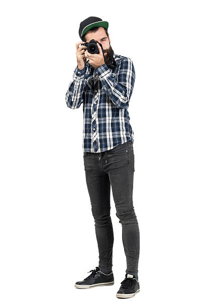 istock Hipster intaking photo with dslr camera looking at camera 508856696