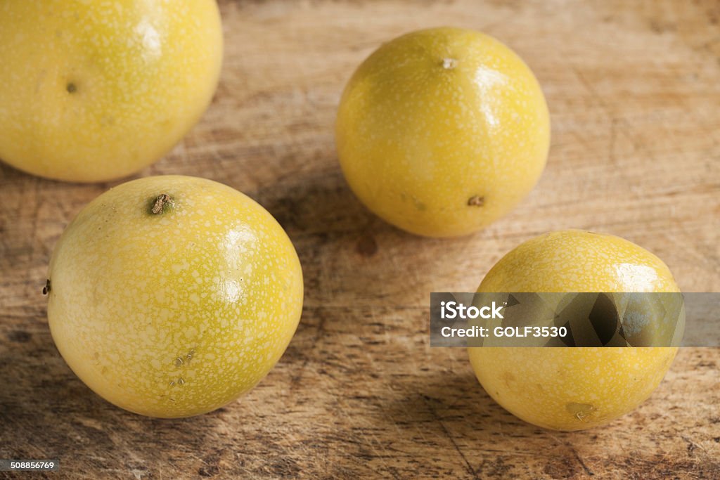 Passion fruits on wooden background. Arrangement Stock Photo