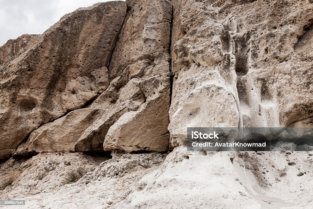 Southwest Rocks Landscape at Bandelier National Monument, New Mexico. Horizontal image featuring the sandstone rock formations in the desert terrain. Ancient Stock Photo