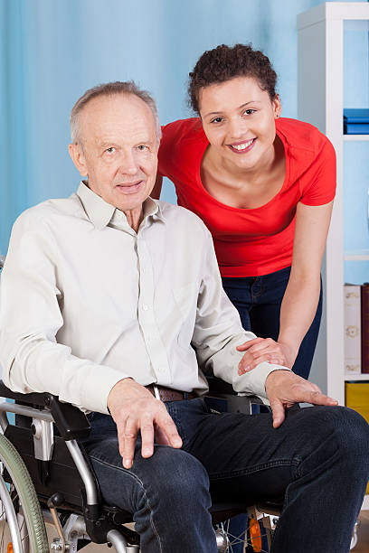 istock Smiling disabled man and nurse 508857815