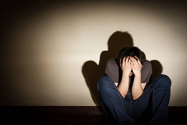 istock depressed despaired young man sit on the floor 508857846