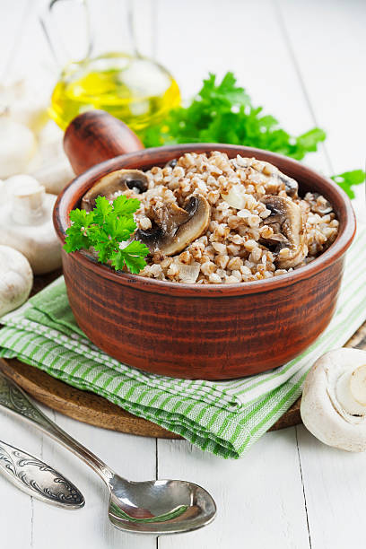 Buckwheat porridge with mushrooms stock photo