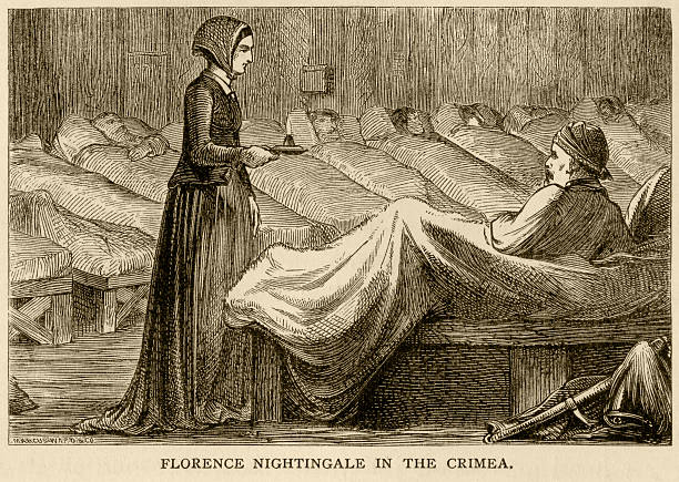 Florence Nightingale in the Crimea Florence Nightingale working at Scutari military hospital in the Crimea, during the Crimean War (1853-56). From “Aunt Charlotte’s Stories of English History for the Little Ones” by Charlotte M Yonge. Published by Marcus Ward & Co, London & Belfast, in 1884. night hospital bed stock illustrations