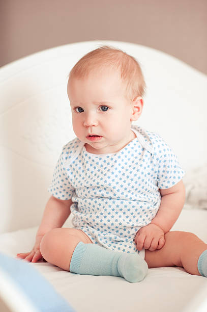 istock Baby girl in bed 508875376