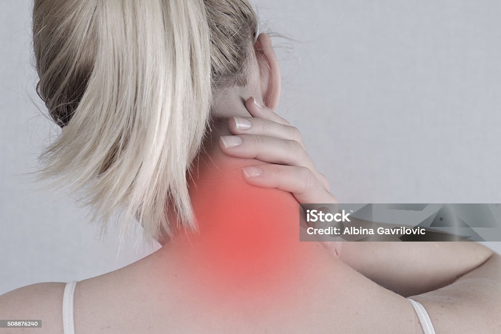 Woman with neck pain close up. Pain relief concept Physical Injury Stock Photo