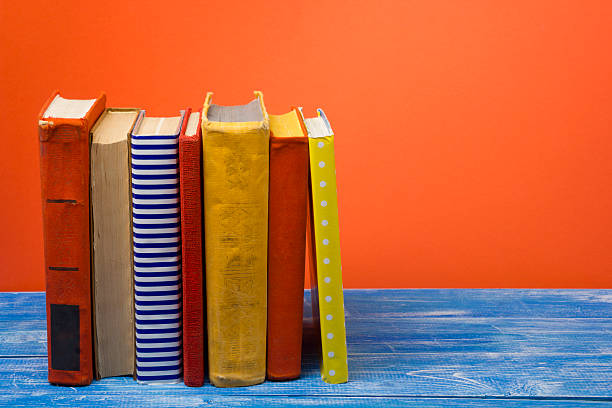 istock Stack of hardback books on wooden table. Back to school 508876946