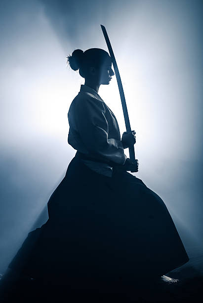 Young woman preparing for aikido training