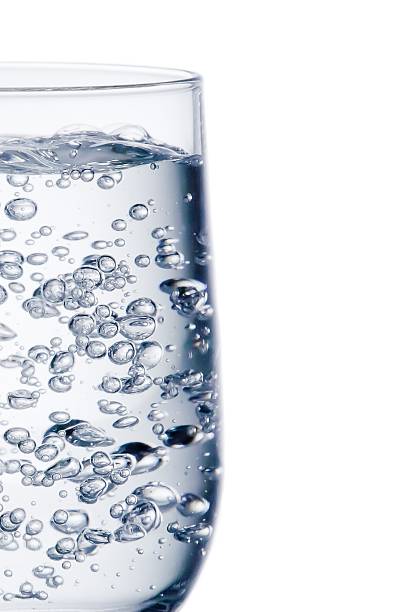 istock half glass of pure water with bubbles 508880488