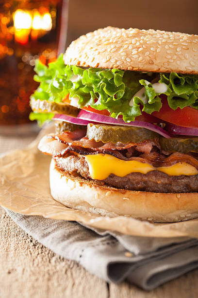 istock bacon cheese burger with pickles tomato onion 508881350