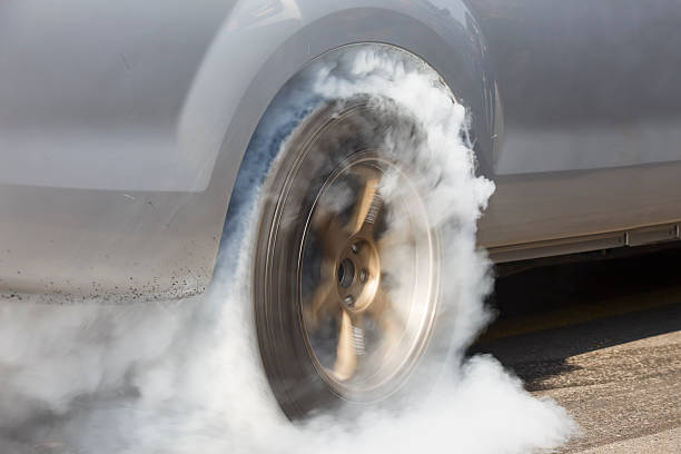 istock Drag racing car burns rubber off its tires 508881706