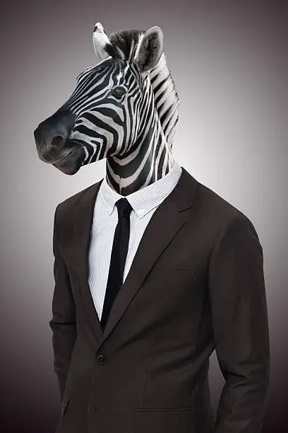 Studio portrait of a businessperson with a zebra head