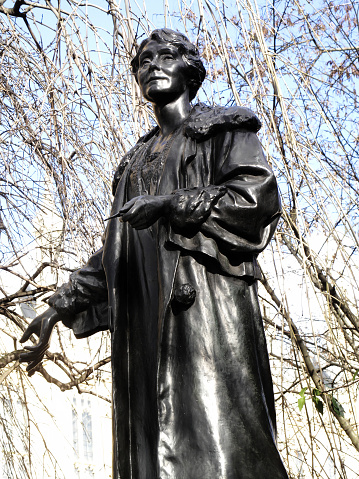 Emily Pankhurst 1858-1928 statue in Victoria Tower Gardens at the Houses of Parliament, London England, UK, was sculptured by Arthur George Walker and unveiled ion 1930