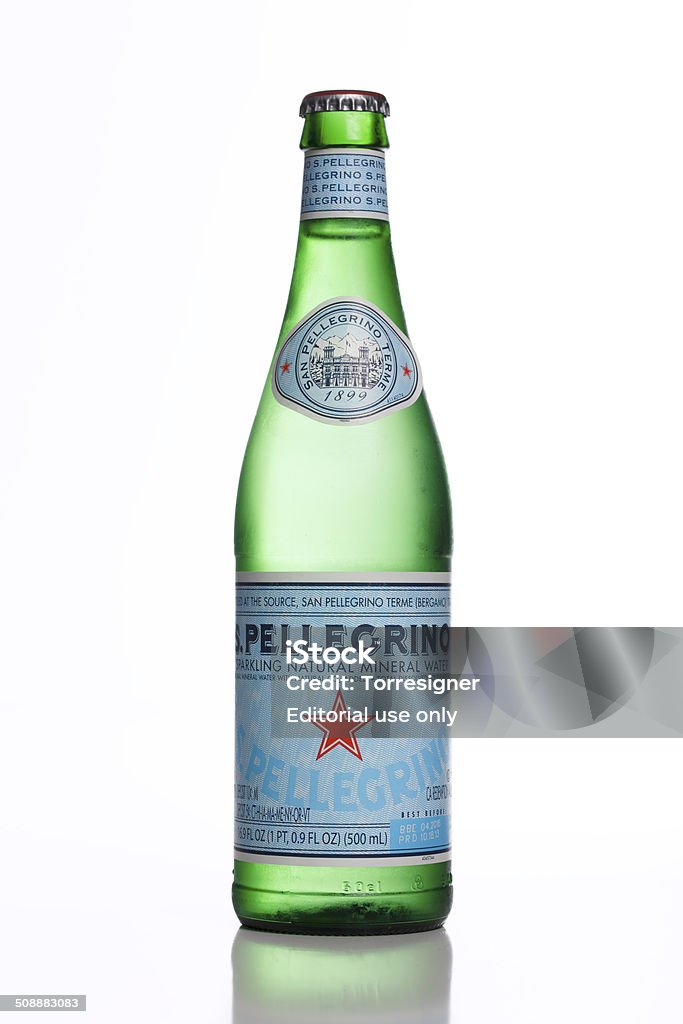 Bottle of Mineral Water Hollywood FL, United States - August 22, 2014: S. Pellegrino bottle isolated on white. 16.9 FL OZ (500ml) green bottle with mineral water with carbonation added. San Pellegrino is a brand produced and bottled at San Pellegrino Terme, in the Province of Bergamo, Lombardy, Italy. San Pellegrino Stock Photo