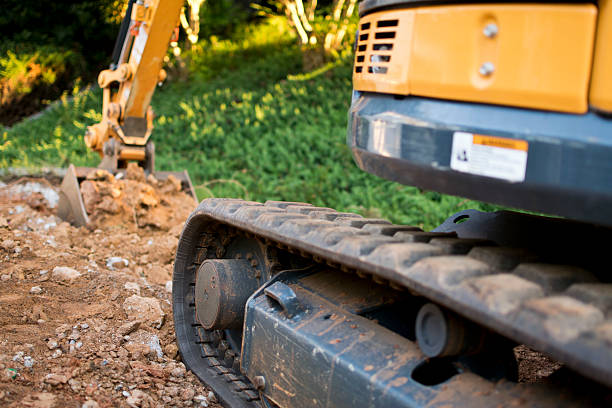 zbliżenie excavator bieżniki - earth mover digging land bulldozer zdjęcia i obrazy z banku zdjęć