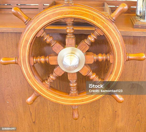 Steering Wheel On A Wooden Boat Stock Photo - Download Image Now - Aboard, Blue, Brown