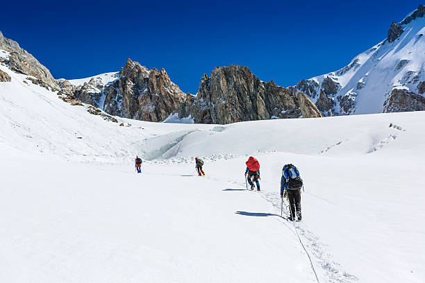 istock group of people with backpacks walking along the glaicer 508884225