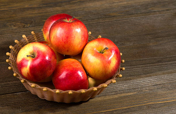istock fresh apples on a wooden table in the background 508884704