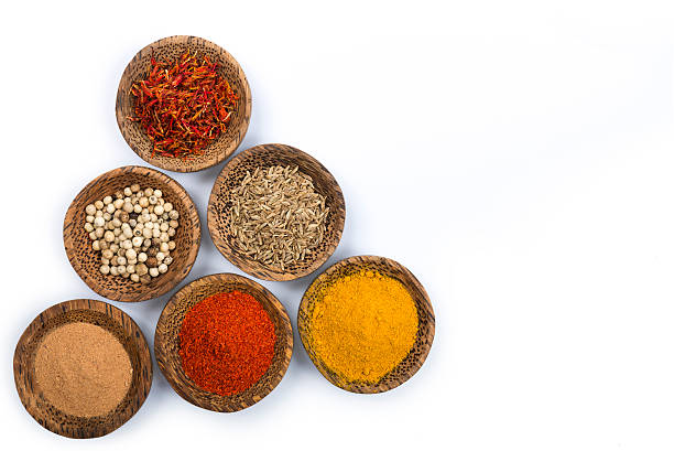 Bowls of spices isolated on white