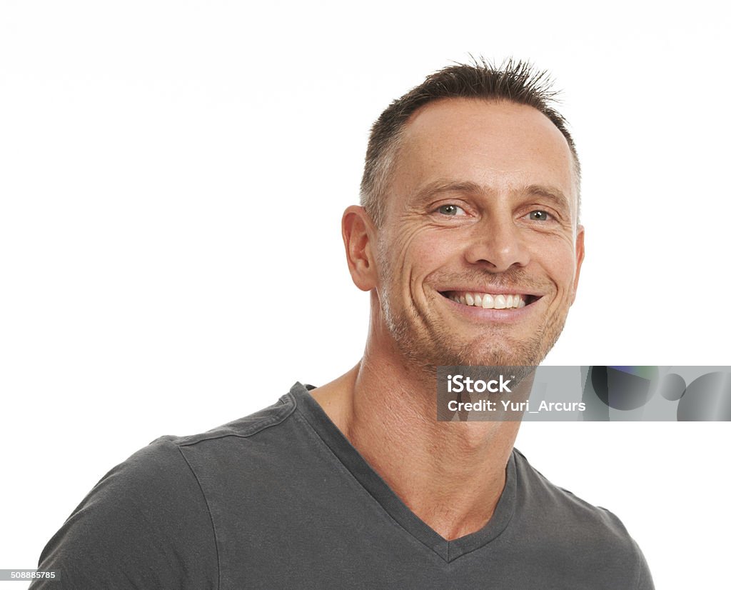 I know who I am and I like it Smiling mature man looking confident while isolated on white - closeup portrait Confidence Stock Photo