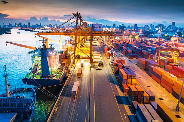 istock Cargo ship in the harbor at sunset . 508888181