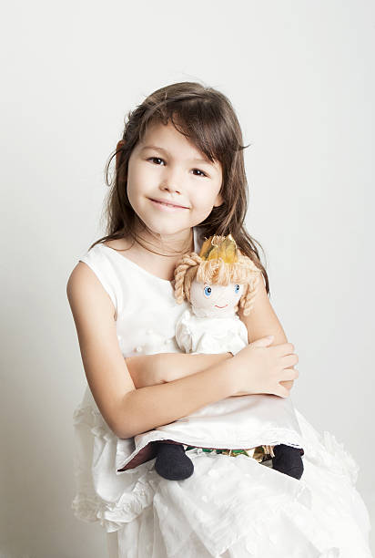 istock Beautiful girl playing with her doll 508894502