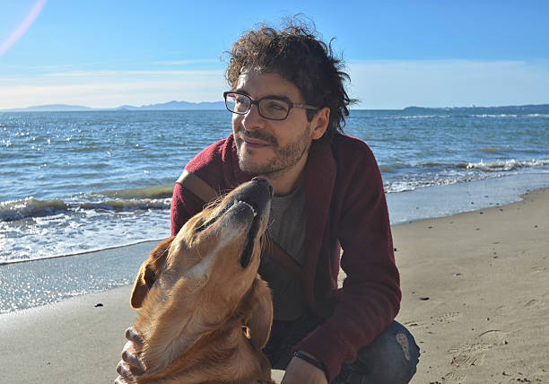 istock Man and dog on the beach 508894846