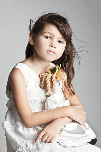 istock Beautiful girl playing with her doll 508895554