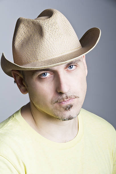 istock Man in a cowboy hat a weary expression on his face 508898094