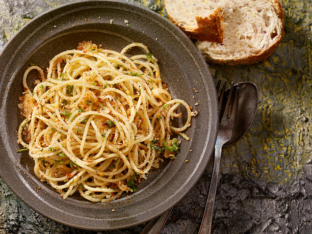 Spaghetti Garlic and Oil Spaghetti Tossed in Roasted Garlic and Olive Oil -Photographed on Hasselblad H3-22mb Camera spaghetti aglio olio stock pictures, royalty-free photos & images