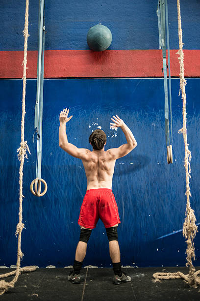 Grugliasco, Italy - December 20, 2015: A young man practising medicine ball techniques during a gym class in the Italian gym Gym \
