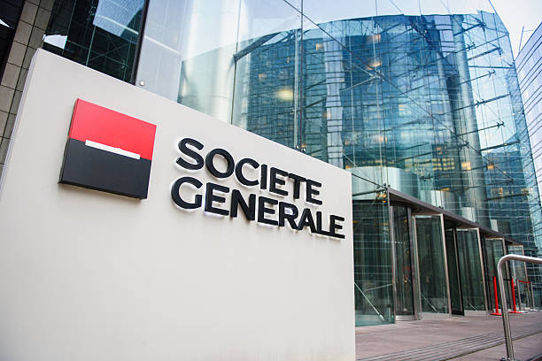 Societe Generale Headquarter entrance in La Defense Paris, France - December 3, 2014: Societe Generale Headquarter entrance in La Defense. The company is a universal bank and has divisions supporting French Networks, Global Transaction Banking, International Retail Banking, Financial services, Corporate and Investment Banking, Private Banking, Asset Management and Securities Services. Societe Generale is the 7th largest bank in Europe (Q4 2015) outer paris stock pictures, royalty-free photos & images
