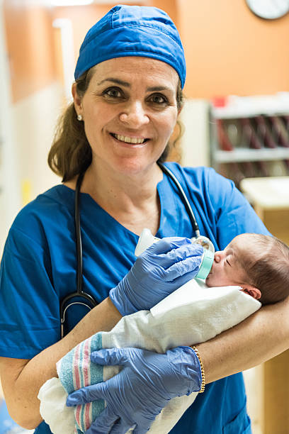 istock Nurse feeding a newborn 508900706
