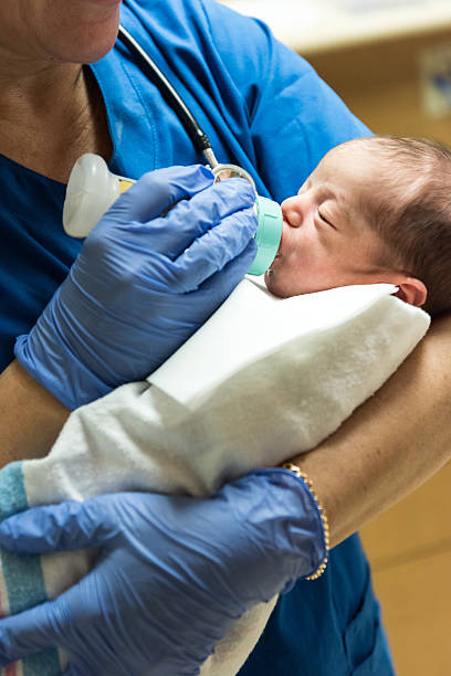 istock Nurse feeding a newborn 508900768