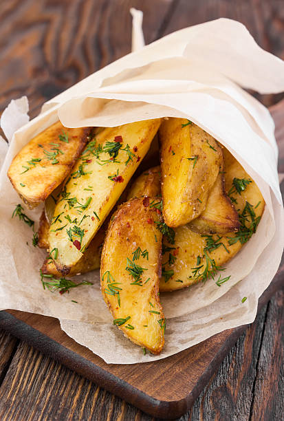 istock Potato with dill on wooden background 508900874