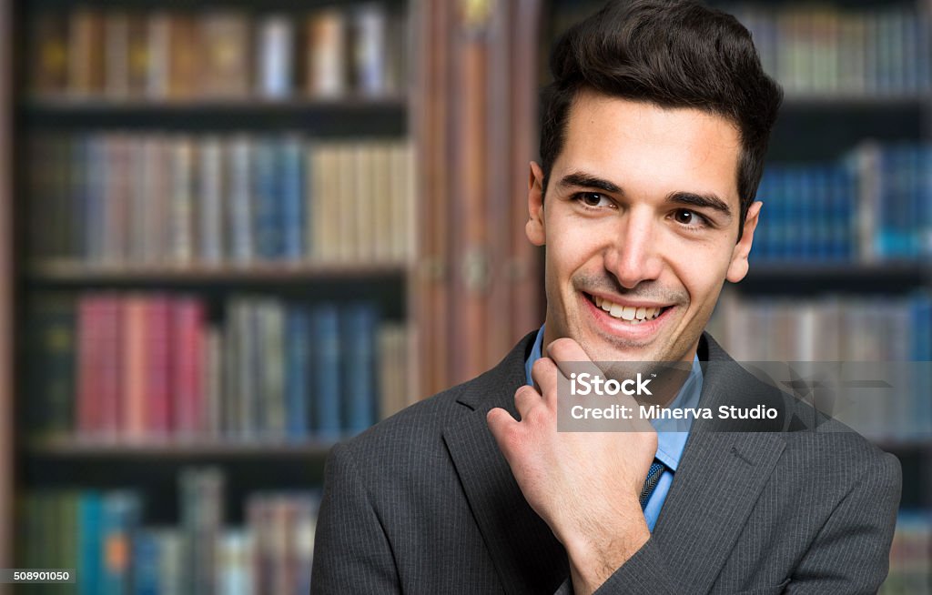 Portrait of a confident man smiling in his office, copy-space Portrait of a confident man smiling in his office Adult Stock Photo